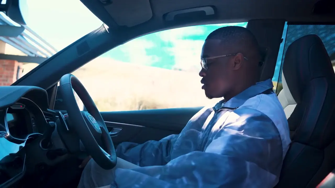Presenter at the wheel inside the Audi RSQ8